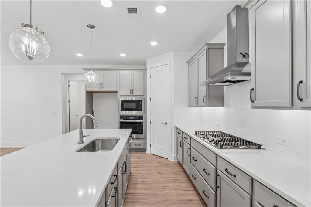 580 Barnfield Way Hiram, GA 30141 - Photo 9 of 12 a kitchen with stainless steel appliances granite countertop a sink stove and refrigerator