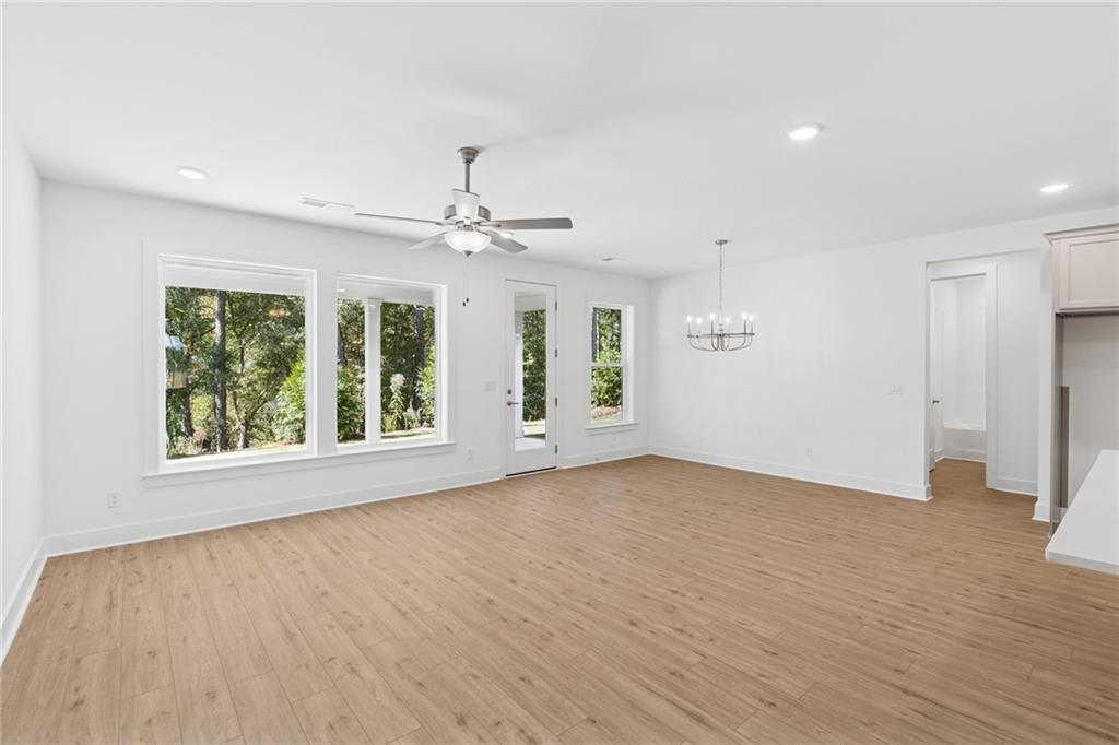 580 Barnfield Way Hiram, GA 30141 - Photo 10 of 12 an empty room with wooden floor and windows