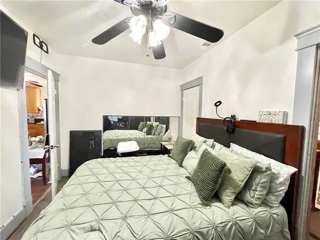 a bedroom with double bed and a lamp