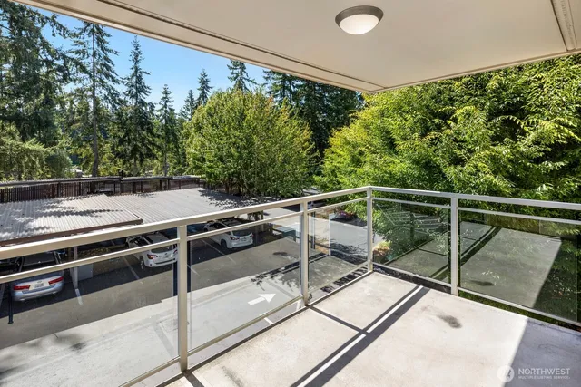 a view of a balcony with chairs