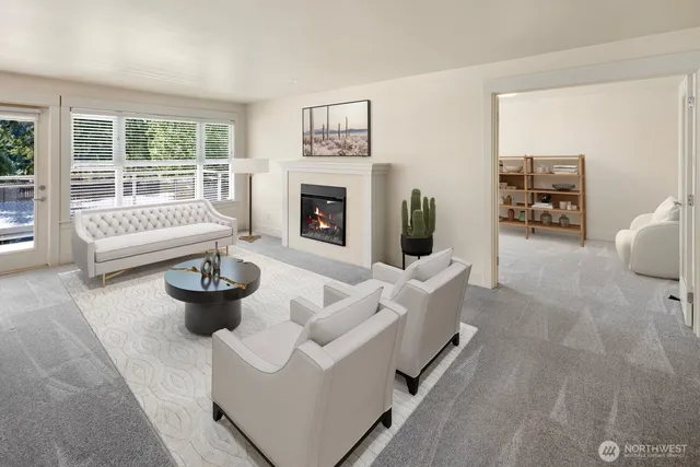 a living room with furniture a fireplace and a potted plant