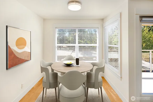 a dining room with furniture and window
