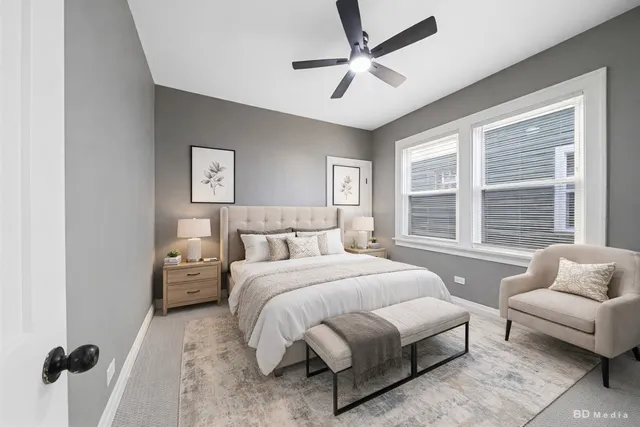 a spacious bedroom with a bed and a couch