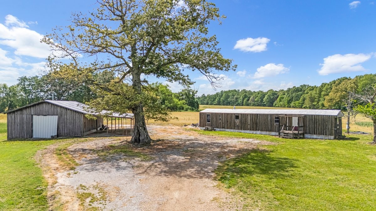 3249 Fredonia Road Manchester, TN 37355 - Photo 3 of 15 a view of a house with a yard balcony and trees