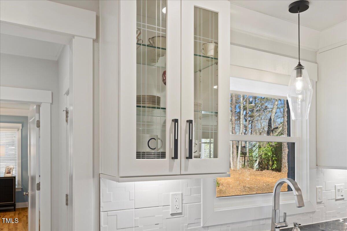 2605 Ridge Road Raleigh, NC 27612 - Photo 13 of 51 a view of a bathroom with a sink and mirror