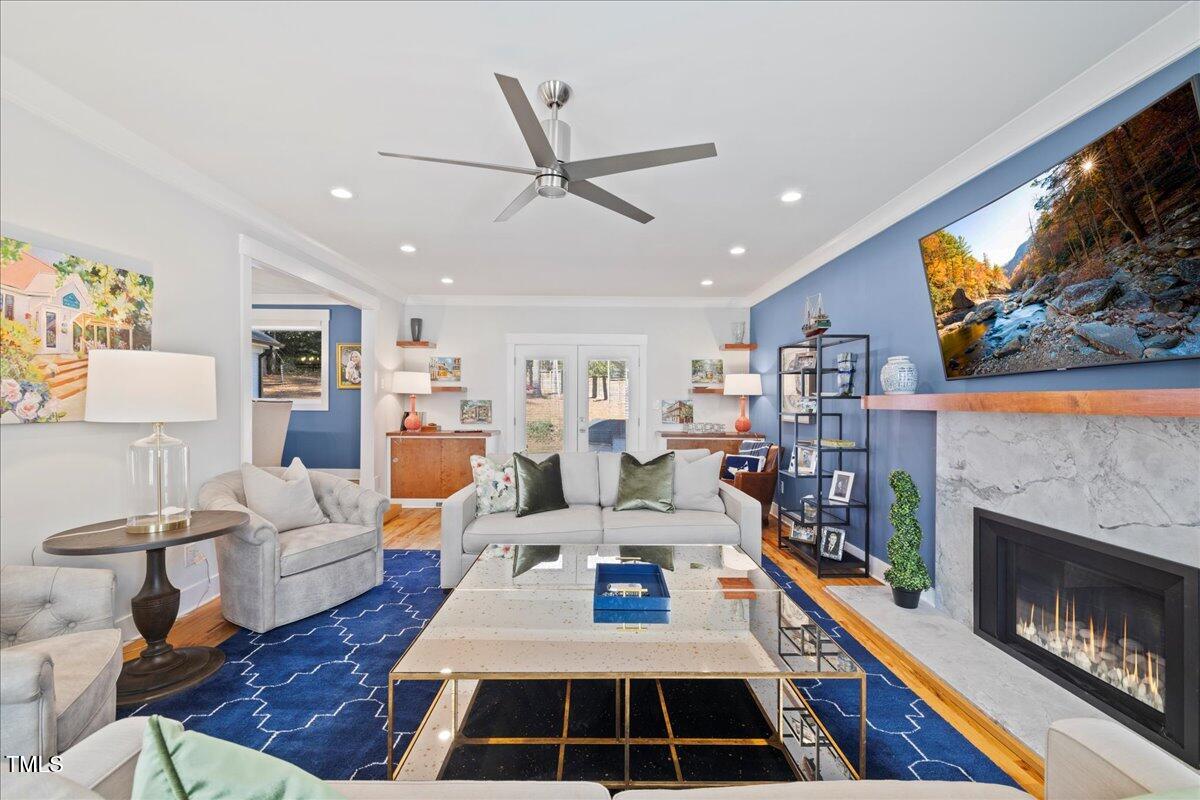 2605 Ridge Road Raleigh, NC 27612 - Photo 17 of 51 a living room with furniture and a fireplace