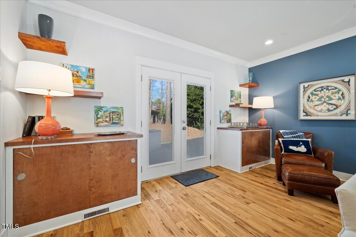 2605 Ridge Road Raleigh, NC 27612 - Photo 19 of 51 a bedroom with furniture and wooden floor
