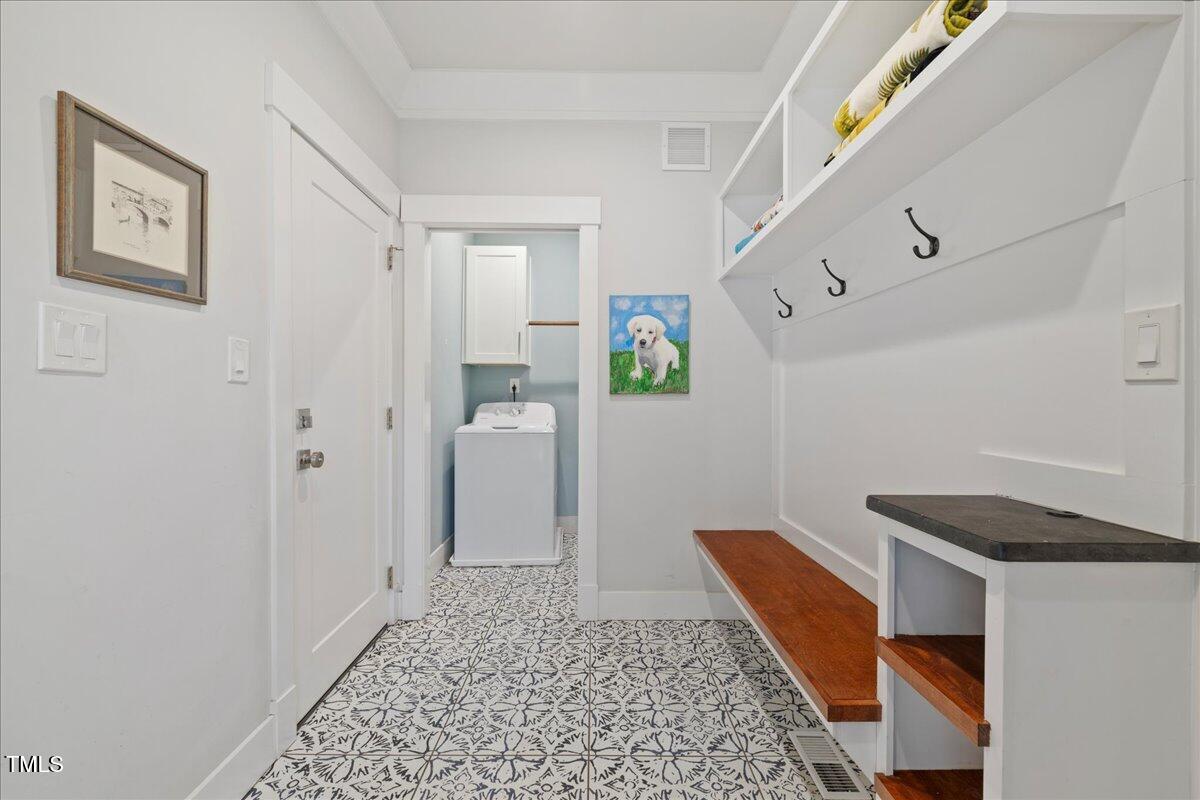 2605 Ridge Road Raleigh, NC 27612 - Photo 21 of 51 a living room with a couch and a rug