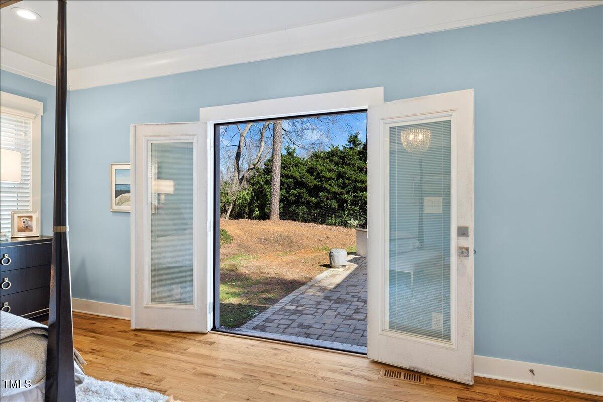 2605 Ridge Road Raleigh, NC 27612 - Photo 24 of 51 a view of a room with wooden floor and front door