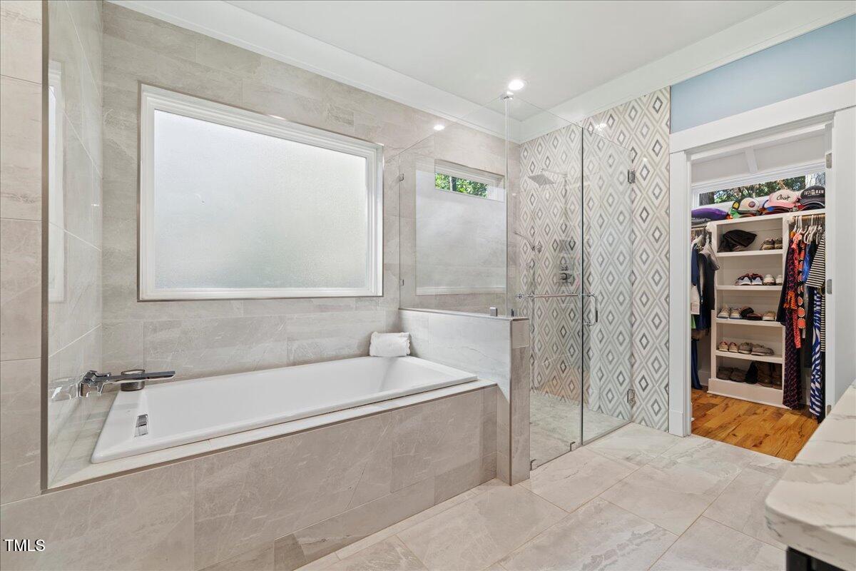 2605 Ridge Road Raleigh, NC 27612 - Photo 29 of 51 a spacious bathroom with a tub and a shower