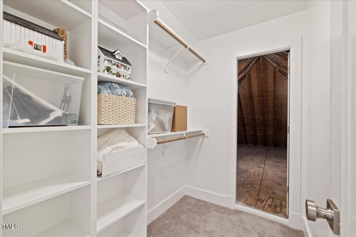 2605 Ridge Road Raleigh, NC 27612 - Photo 39 of 51 a view of storage and utility room with cabinet