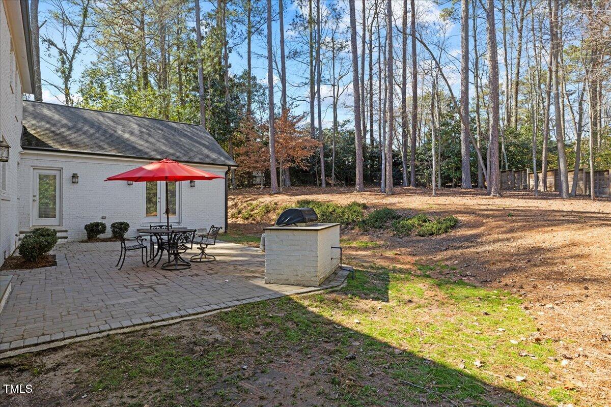 2605 Ridge Road Raleigh, NC 27612 - Photo 48 of 51 an outdoor space with furniture and umbrella