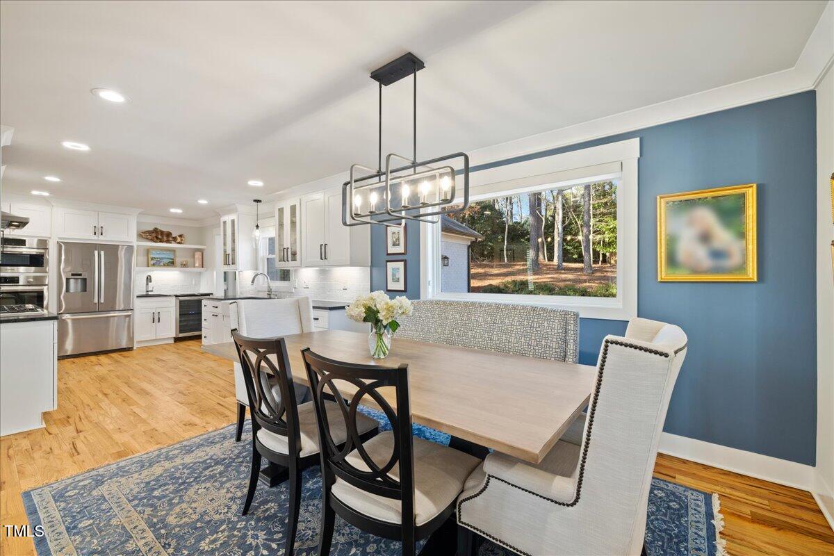 2605 Ridge Road Raleigh, NC 27612 - Photo 8 of 51 a view of a dining room with furniture window and wooden floor