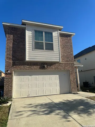 a front view of a house with a garage