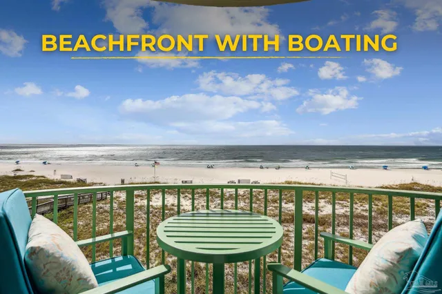 a view of a chairs and table in the balcony