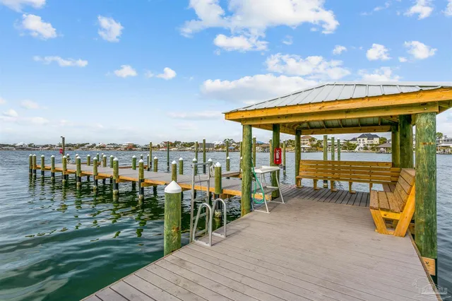 an aerial view of a swimming pool with outdoor seating