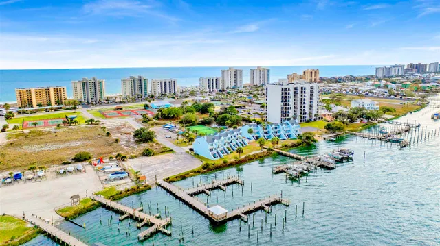 a living room with furniture a flat screen tv and a large window