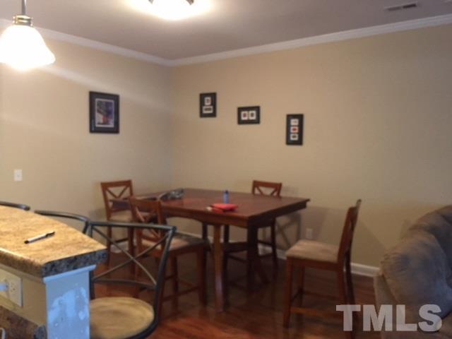 2013 Fieldhouse Avenue Raleigh, NC 27603 - Photo 3 of 4 a view of a dining room with furniture and wooden floor