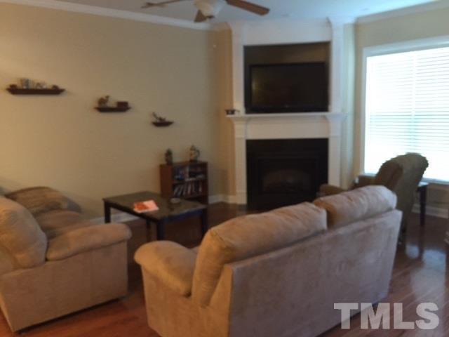 2013 Fieldhouse Avenue Raleigh, NC 27603 - Photo 4 of 4 a living room with furniture and a fireplace