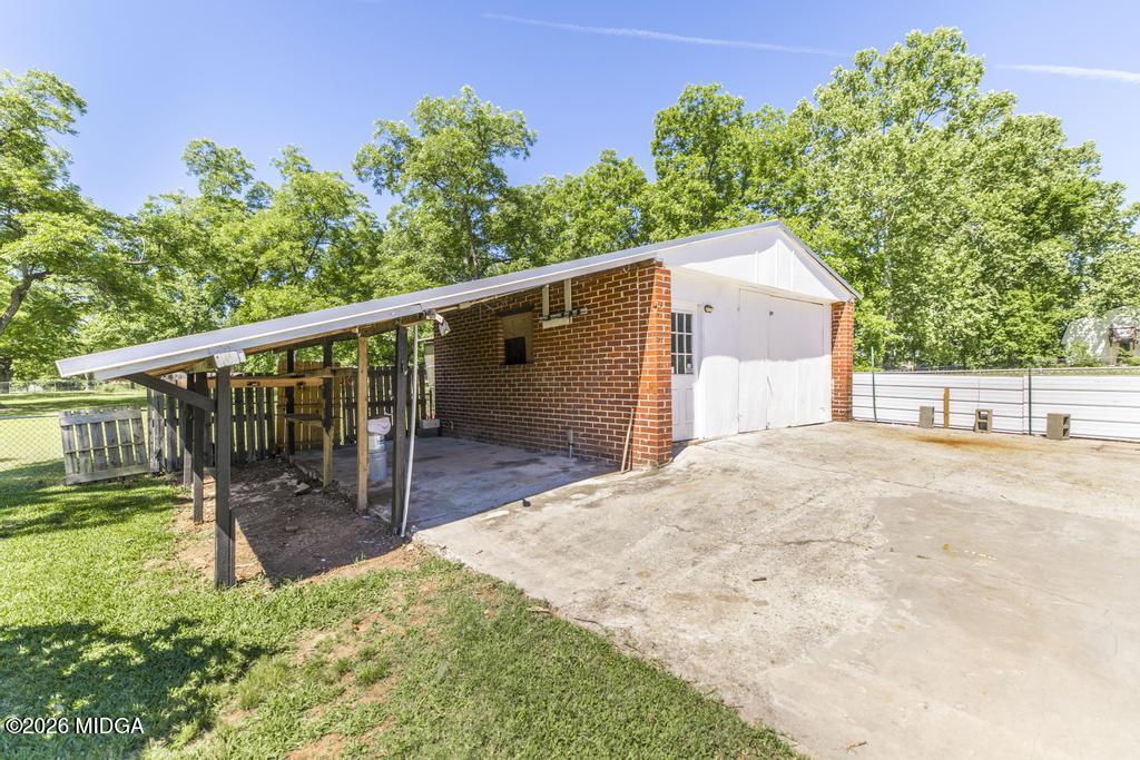3710 Sandy Circle Macon, GA 31216 - Photo 43 of 44 a view of a backyard with a small cabin