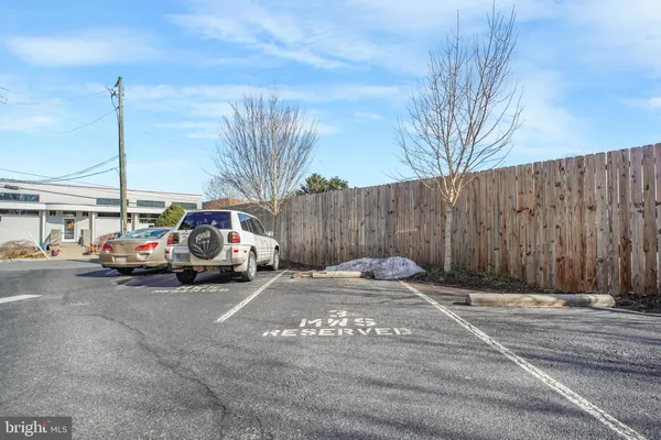 a view of street with parked cars