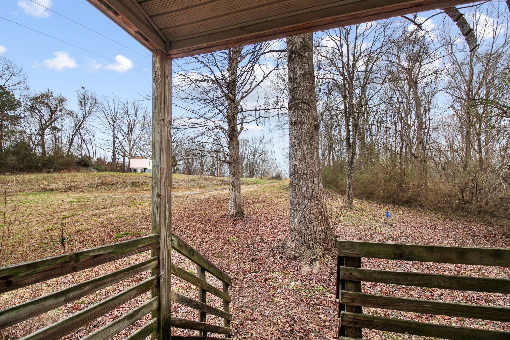 7164 Brush Creek Road South Fairview, TN 37062 - Photo 6 of 11 a view of a room with wooden floor and fence