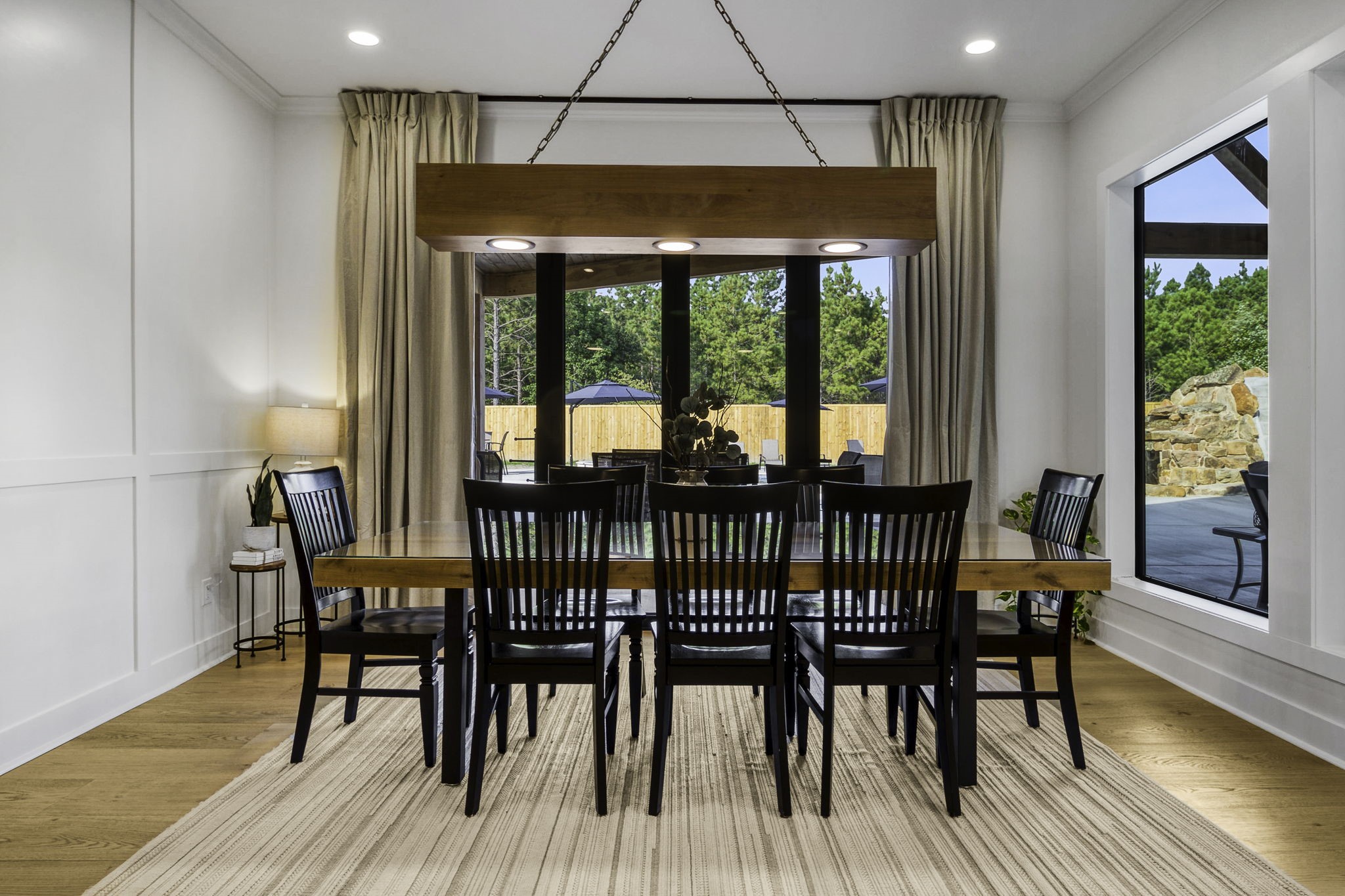 4602 Fm 3459 Road Onalaska, TX 77360 - Photo 16 of 45 a dining room with furniture a chandelier and wooden floor
