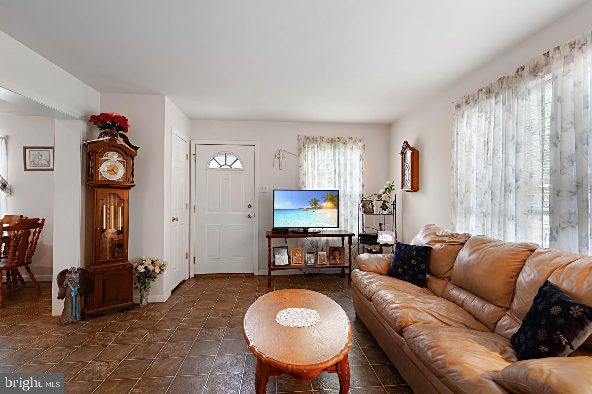 315 Beech Road Millville, NJ 08332 - Photo 10 of 21 a living room with furniture a window and a flat screen tv