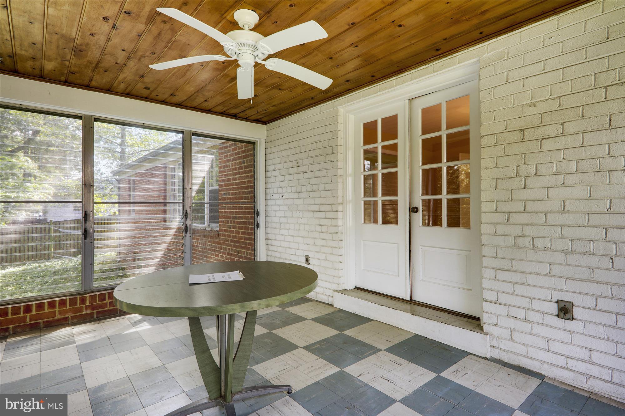 3303 Winnett Road Chevy Chase, MD 20815 - Photo 16 of 54 a front view of a house with a glass windows and a table