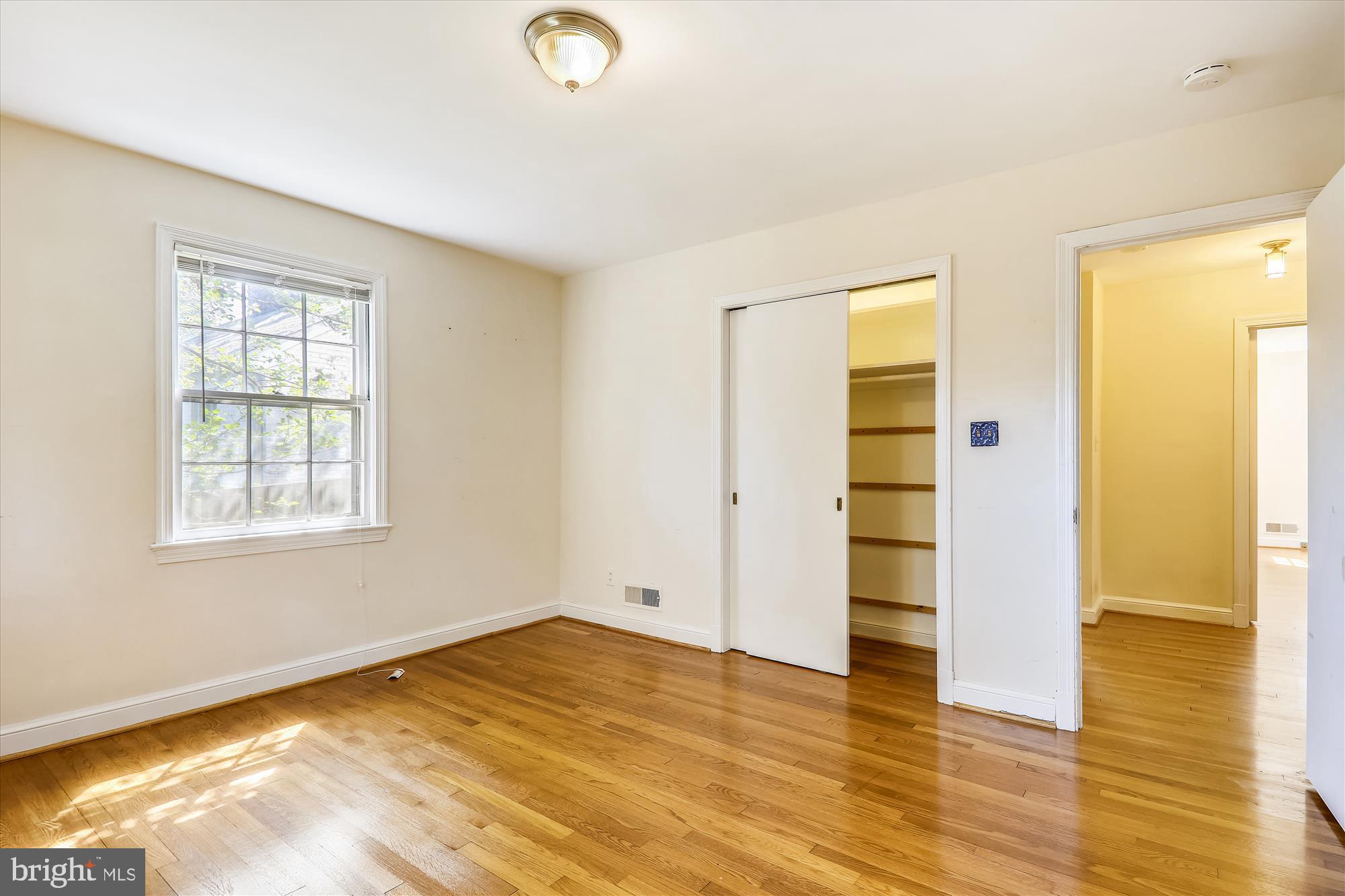 3303 Winnett Road Chevy Chase, MD 20815 - Photo 24 of 54 a view of empty room with wooden floor and fan