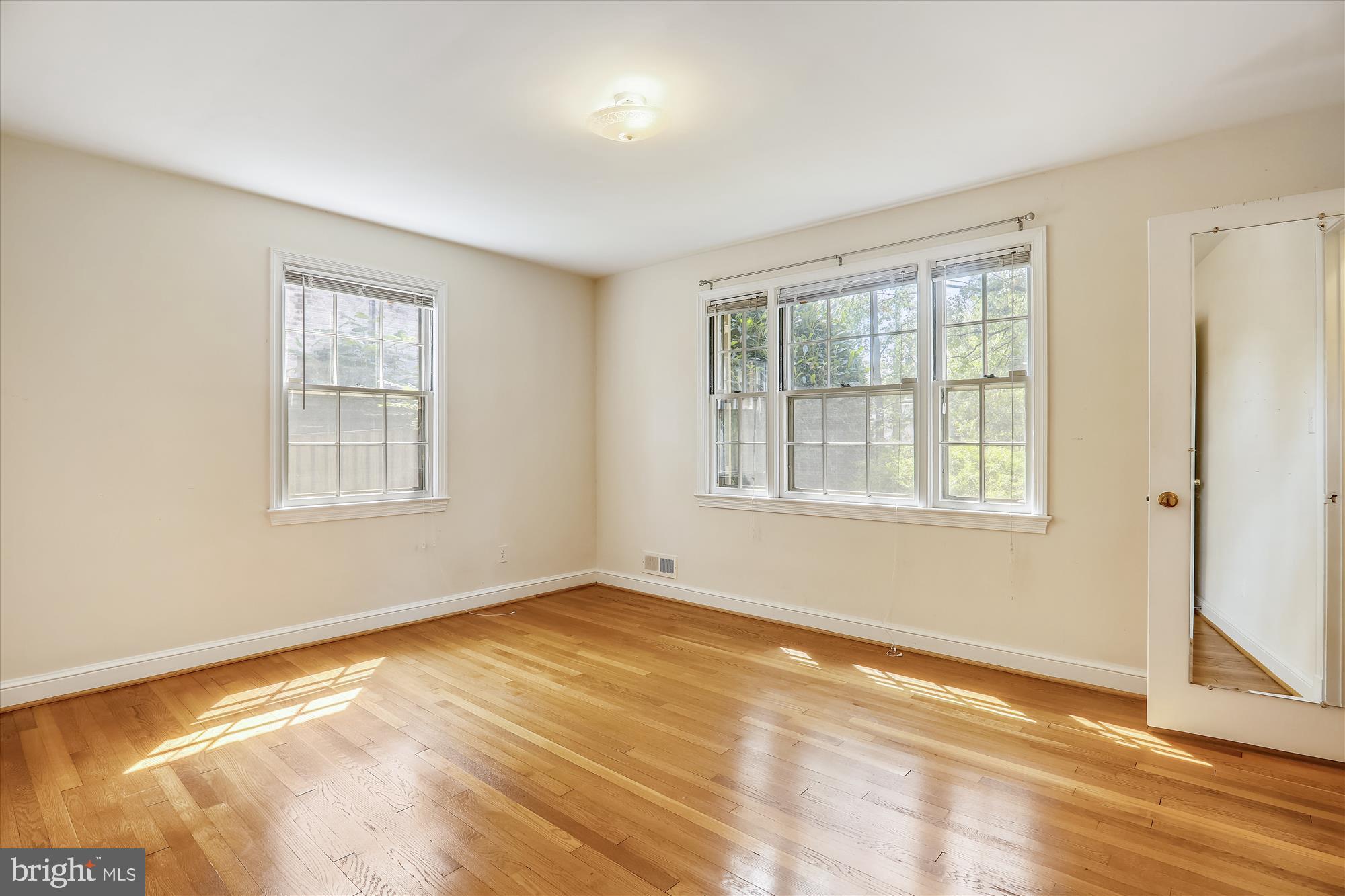 3303 Winnett Road Chevy Chase, MD 20815 - Photo 25 of 54 a view of an empty room with a window