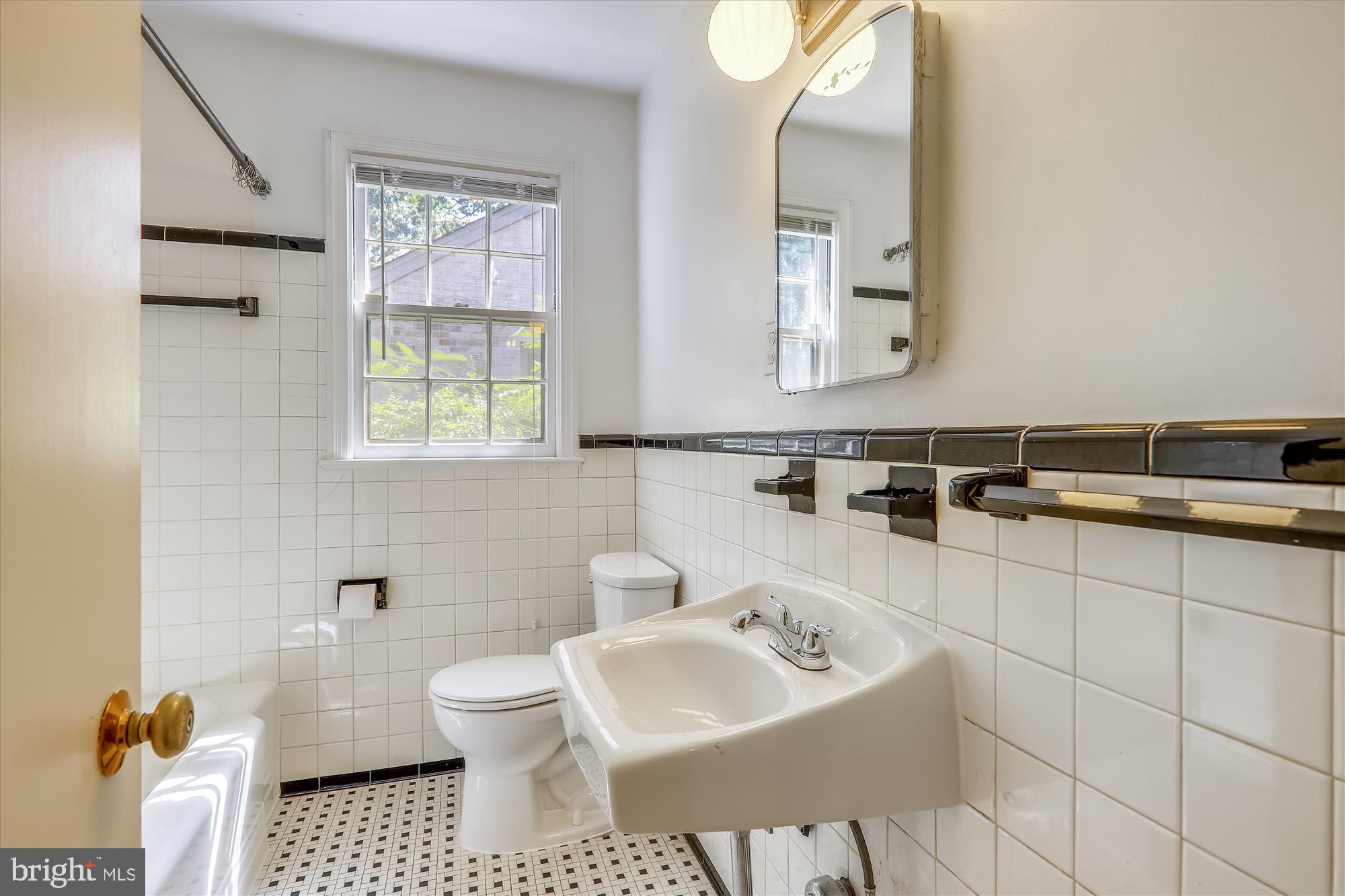 3303 Winnett Road Chevy Chase, MD 20815 - Photo 29 of 54 a bathroom with a sink toilet and mirror