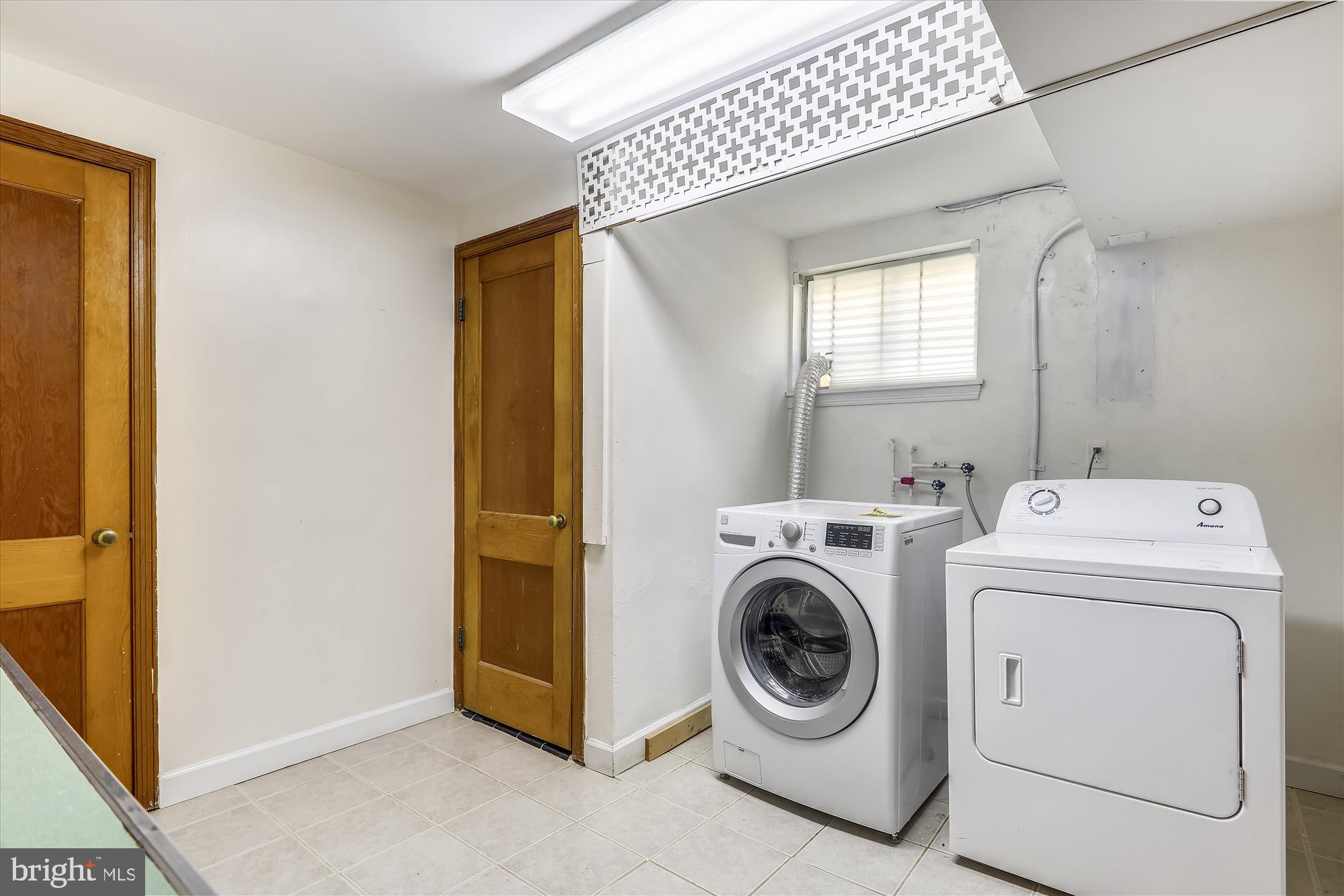 3303 Winnett Road Chevy Chase, MD 20815 - Photo 35 of 54 a utility room with dryer and washer