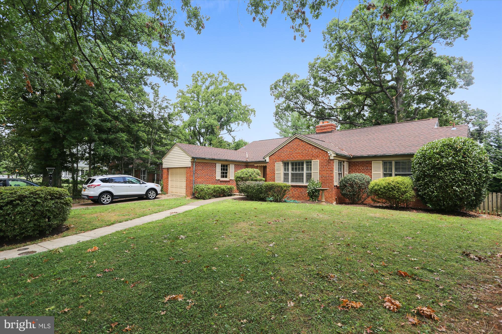 3303 Winnett Road Chevy Chase, MD 20815 - Photo 48 of 54 a front view of a house with a garden