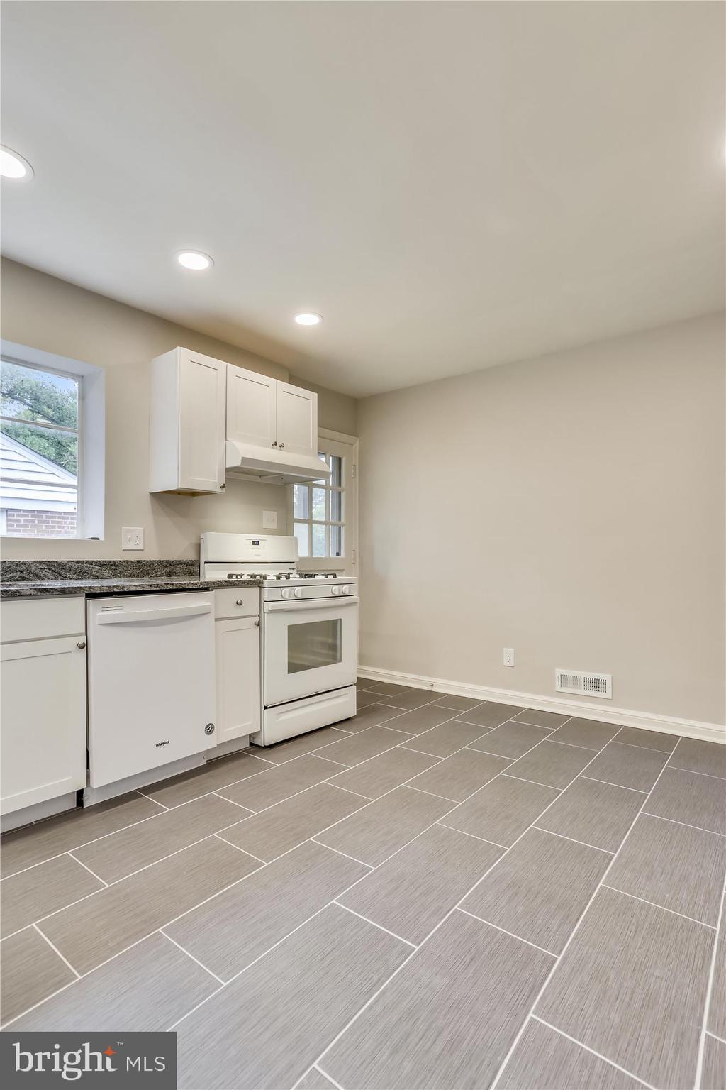 3303 Winnett Road Chevy Chase, MD 20815 - Photo 7 of 54 a view of a kitchen with stainless steel appliances cabinets and a window