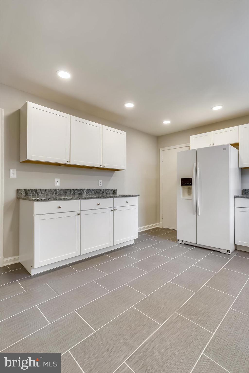 3303 Winnett Road Chevy Chase, MD 20815 - Photo 10 of 54 a view of a kitchen with a sink and a refrigerator