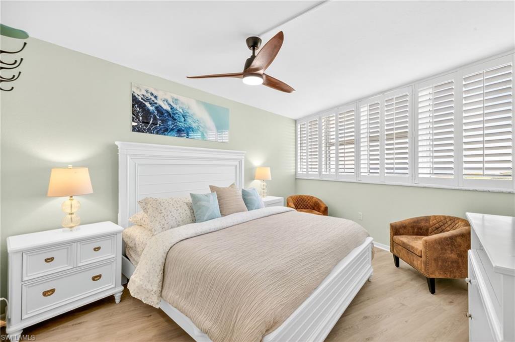 58 North Collier Boulevard, Unit 1606 Marco Island, FL 34145 - Photo 18 of 37 a bedroom with a bed and a window
