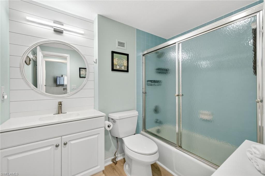 58 North Collier Boulevard, Unit 1606 Marco Island, FL 34145 - Photo 21 of 37 a bathroom with a toilet sink and shower