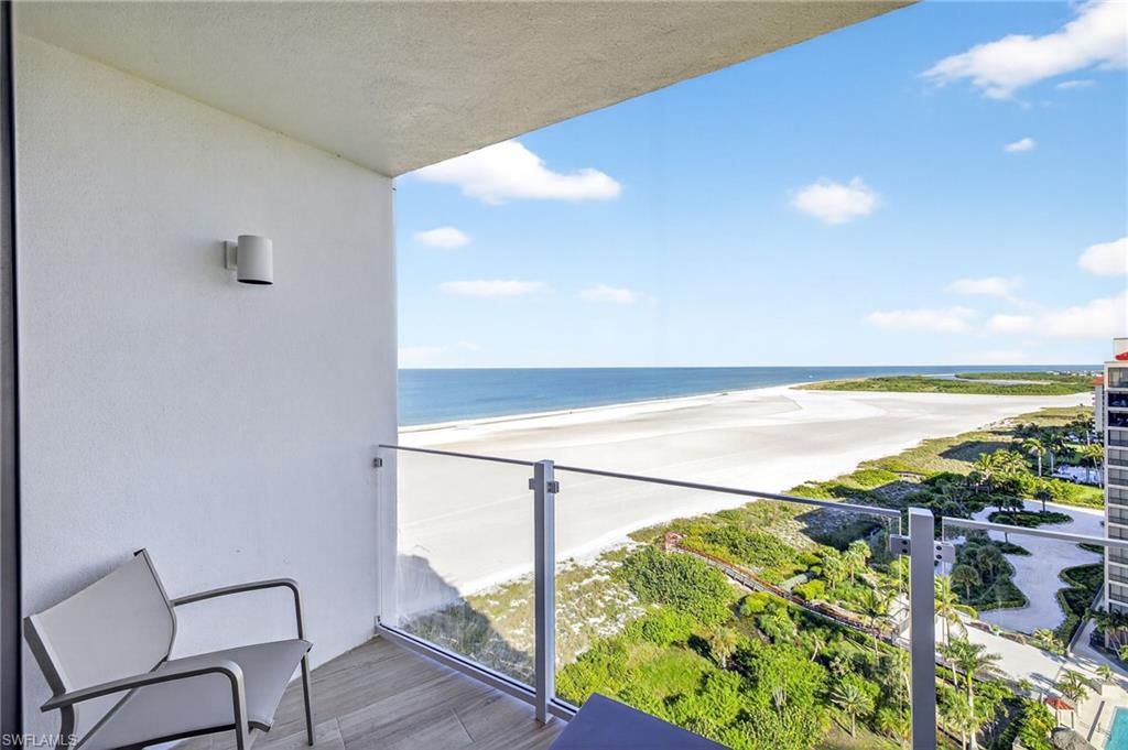 58 North Collier Boulevard, Unit 1606 Marco Island, FL 34145 - Photo 22 of 37 a view of a balcony with an ocean view
