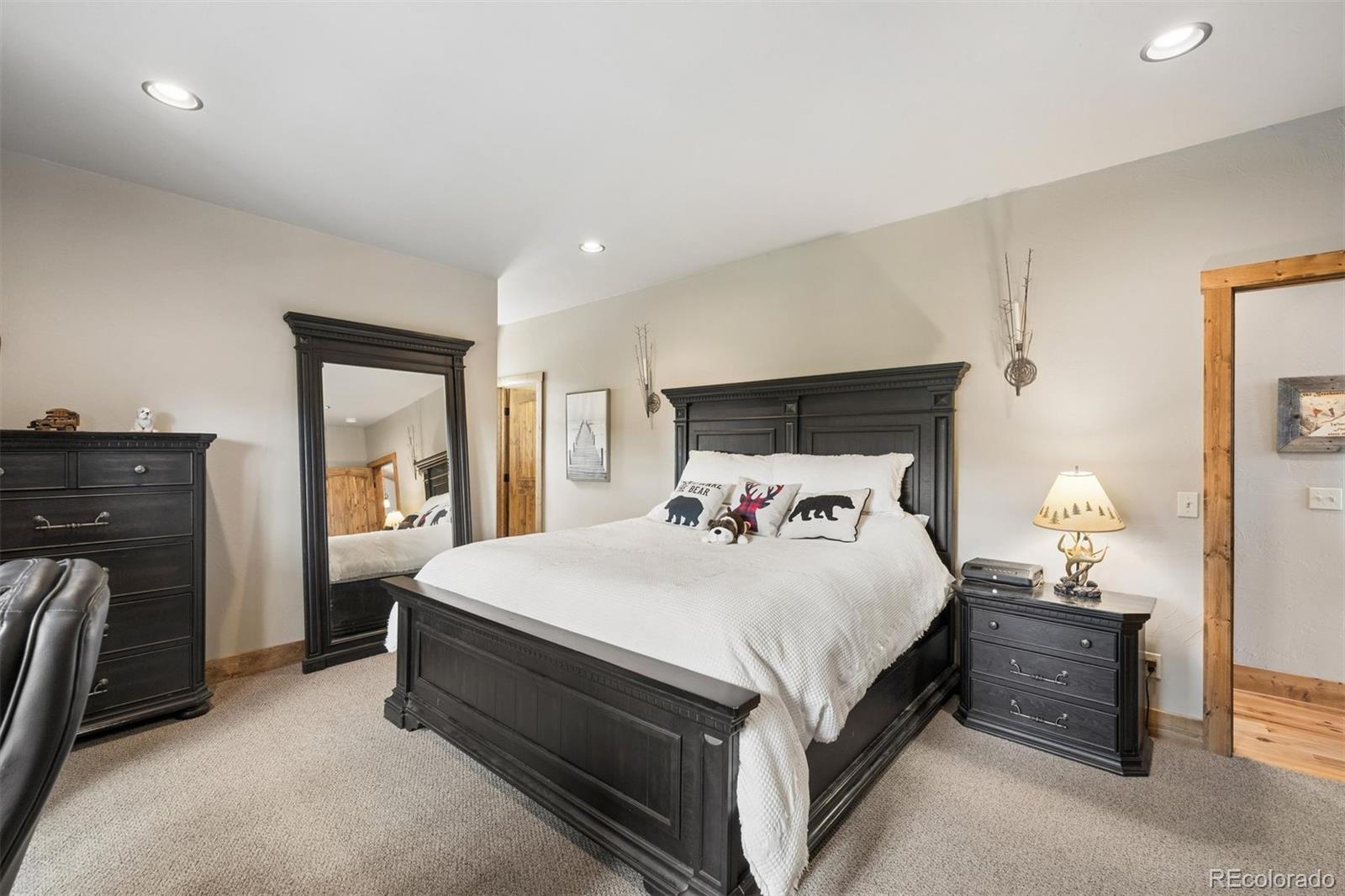 2894 County Road 43 Bailey, CO 80421 - Photo 15 of 40 a bedroom with a bed and a dresser
