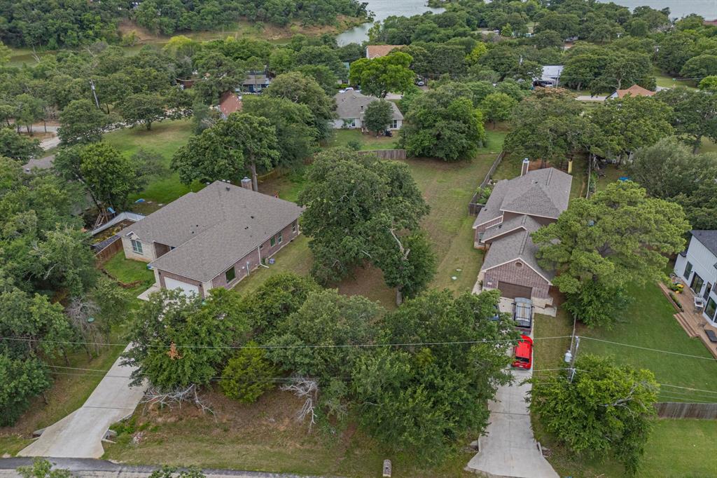 563 Valley Drive Oak Point, TX 75068 - Photo 3 of 5 an aerial view of a house with outdoor space and a lake view