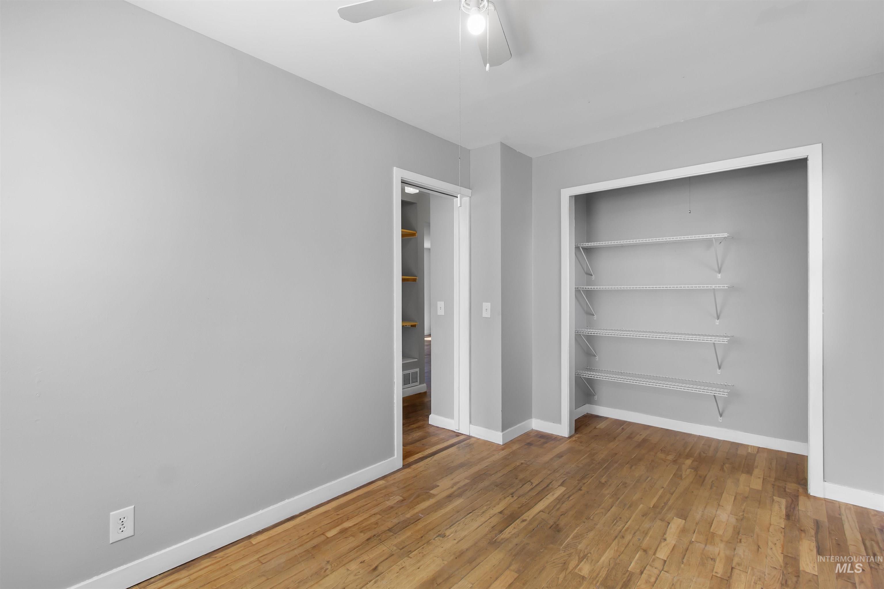 412 Madison Street Twin Falls, ID 83301 - Photo 11 of 42 Unfurnished bedroom with light wood-type flooring, a closet, and a ceiling fan