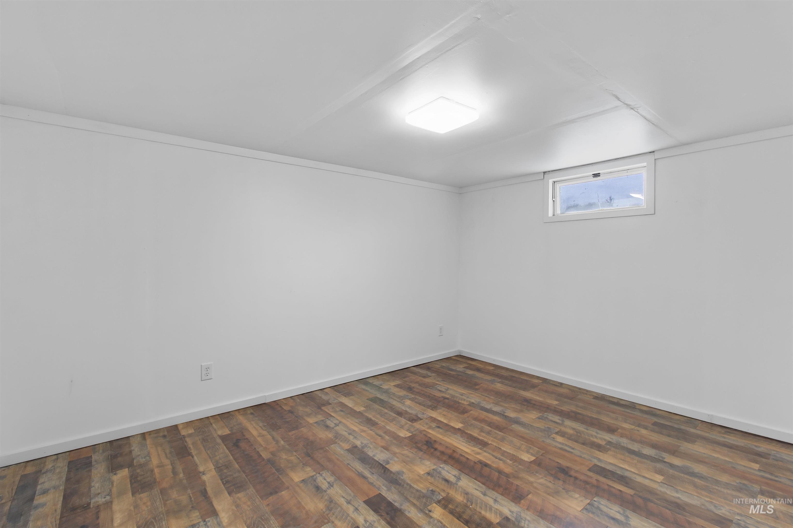 412 Madison Street Twin Falls, ID 83301 - Photo 19 of 42 Below grade area with dark wood finished floors