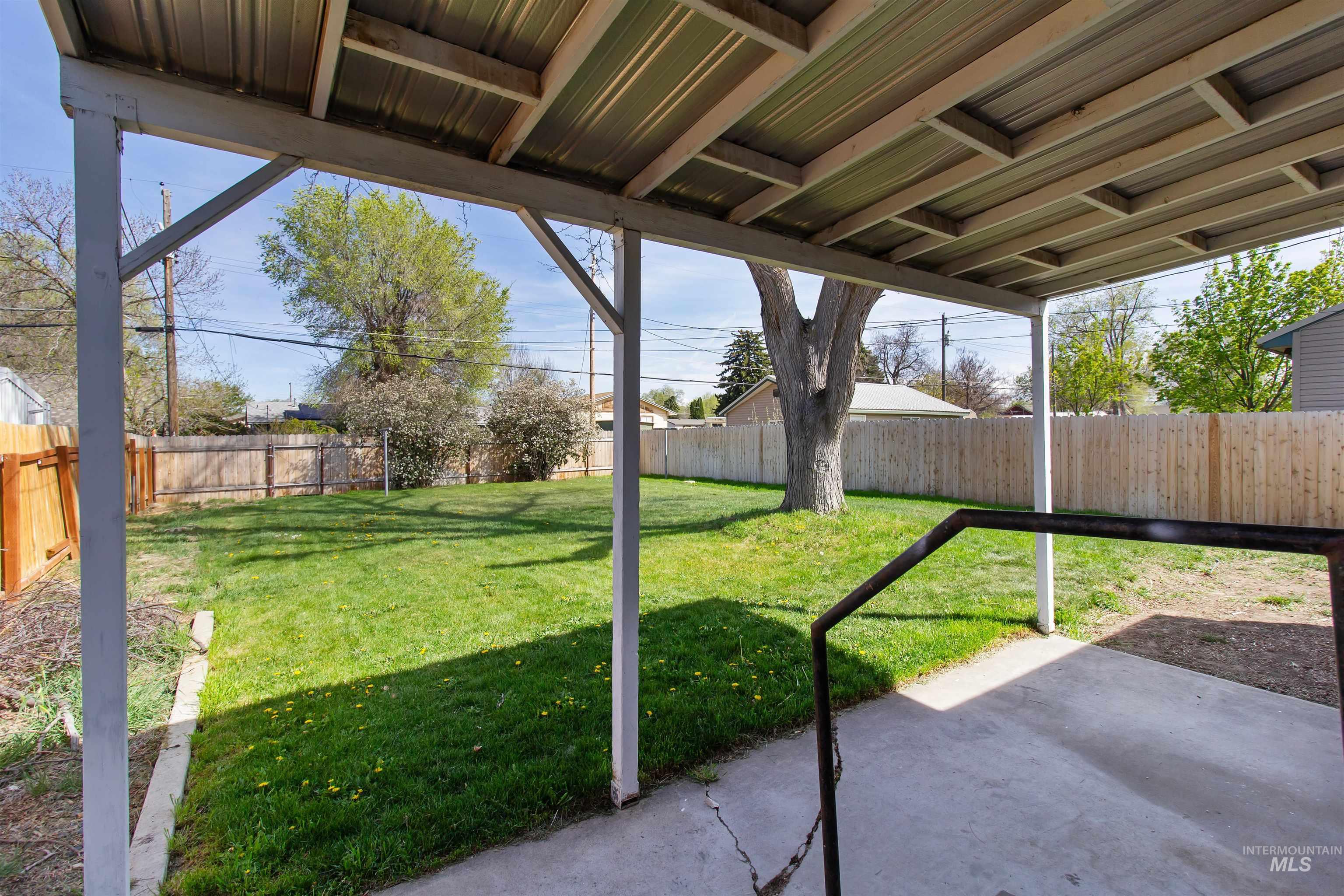 412 Madison Street Twin Falls, ID 83301 - Photo 25 of 42 Fenced backyard with a patio area