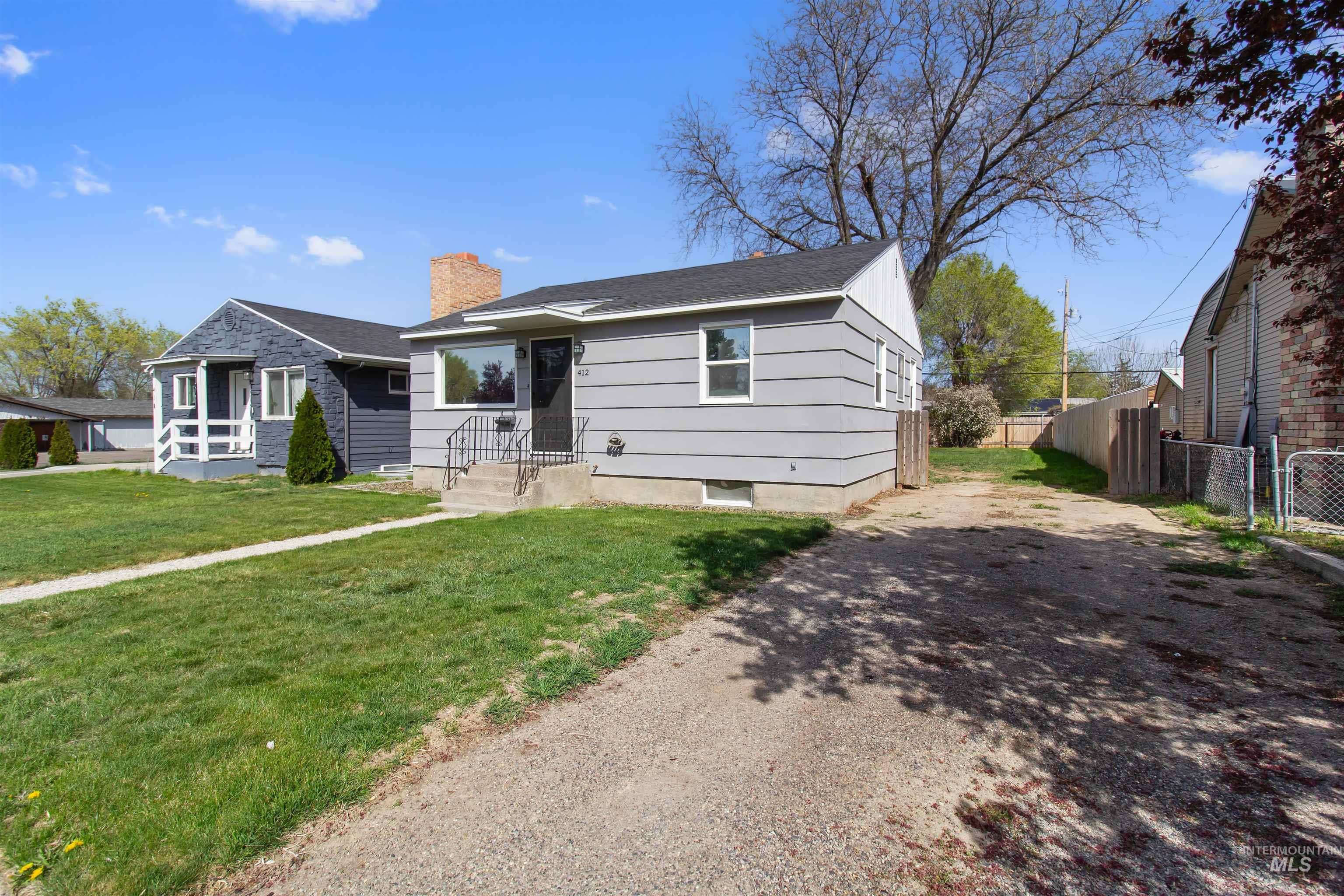 412 Madison Street Twin Falls, ID 83301 - Photo 40 of 42 View of front facade with driveway and a chimney