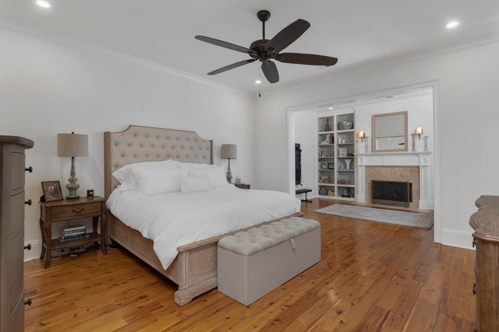 5097 Cole Road Memphis, TN 38117 - Photo 11 of 25 a spacious bedroom with a bed and a fireplace