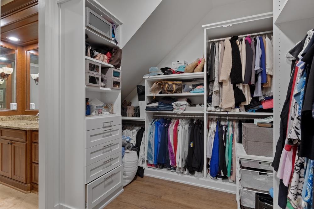 5097 Cole Road Memphis, TN 38117 - Photo 16 of 25 a view of walk in closet with clothes and shoes