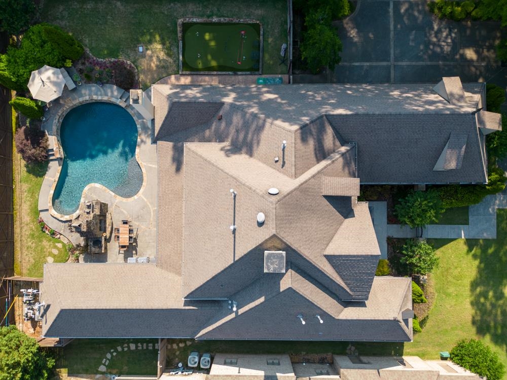 5097 Cole Road Memphis, TN 38117 - Photo 25 of 25 an aerial view of a house with swimming pool and big yard