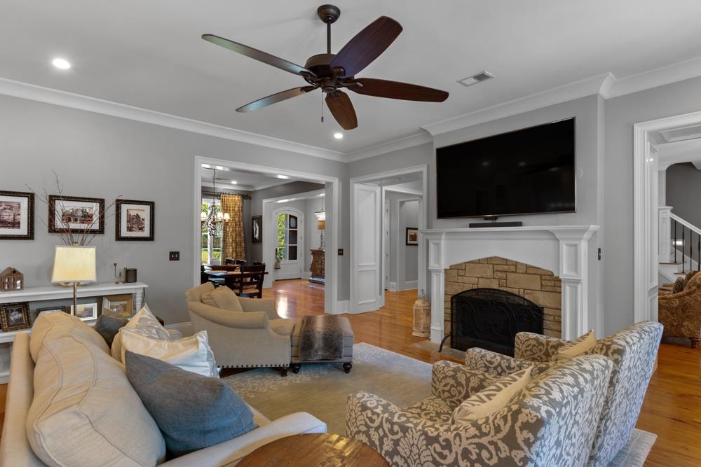 5097 Cole Road Memphis, TN 38117 - Photo 5 of 25 a living room with furniture a fireplace and a flat screen tv