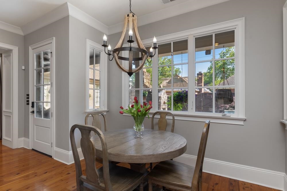 5097 Cole Road Memphis, TN 38117 - Photo 9 of 25 a view of a dining room with furniture window and wooden floor